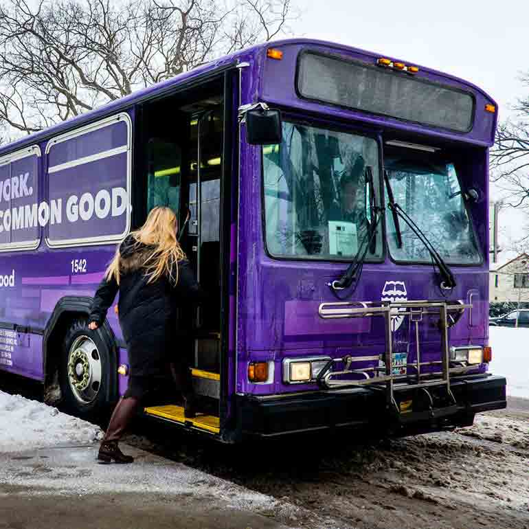 Student boarding campus shuttle