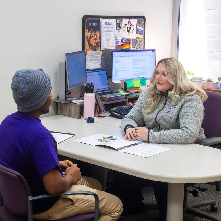 counselor advising student during appointment