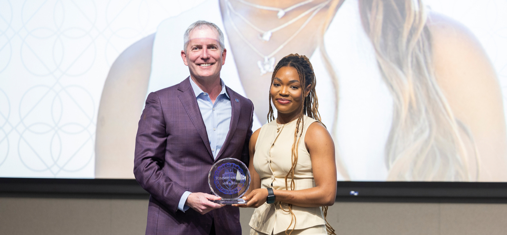 Rachel Theophilus receives her award at St. Thomas Day in Woulfe Hall on May 06, 2026 in St. Paul.