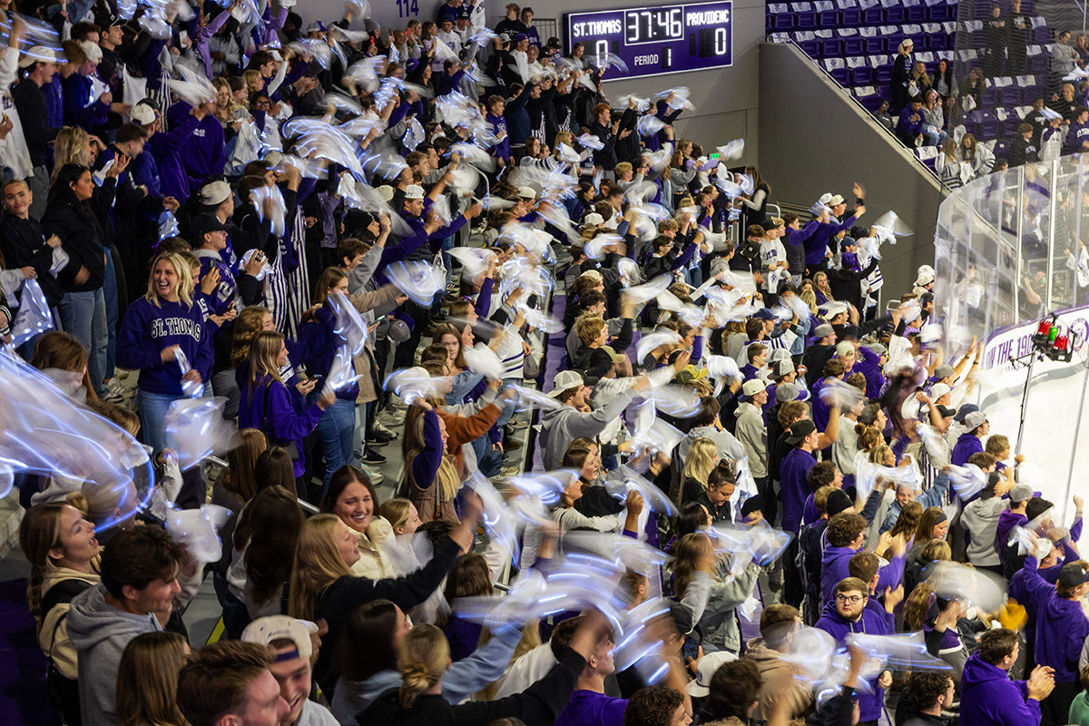 Students waving towels and cheering
