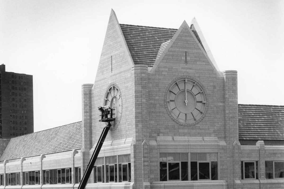 Work being performed on the clock tower of Terrence Murphy Hall.