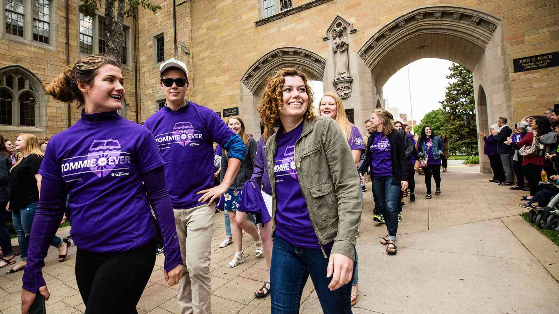 Students walk through the Arches during the senior class March Out of the Arches.