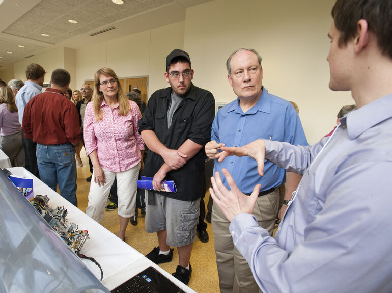 Student explains project during Senior Engineering Design Clinic event