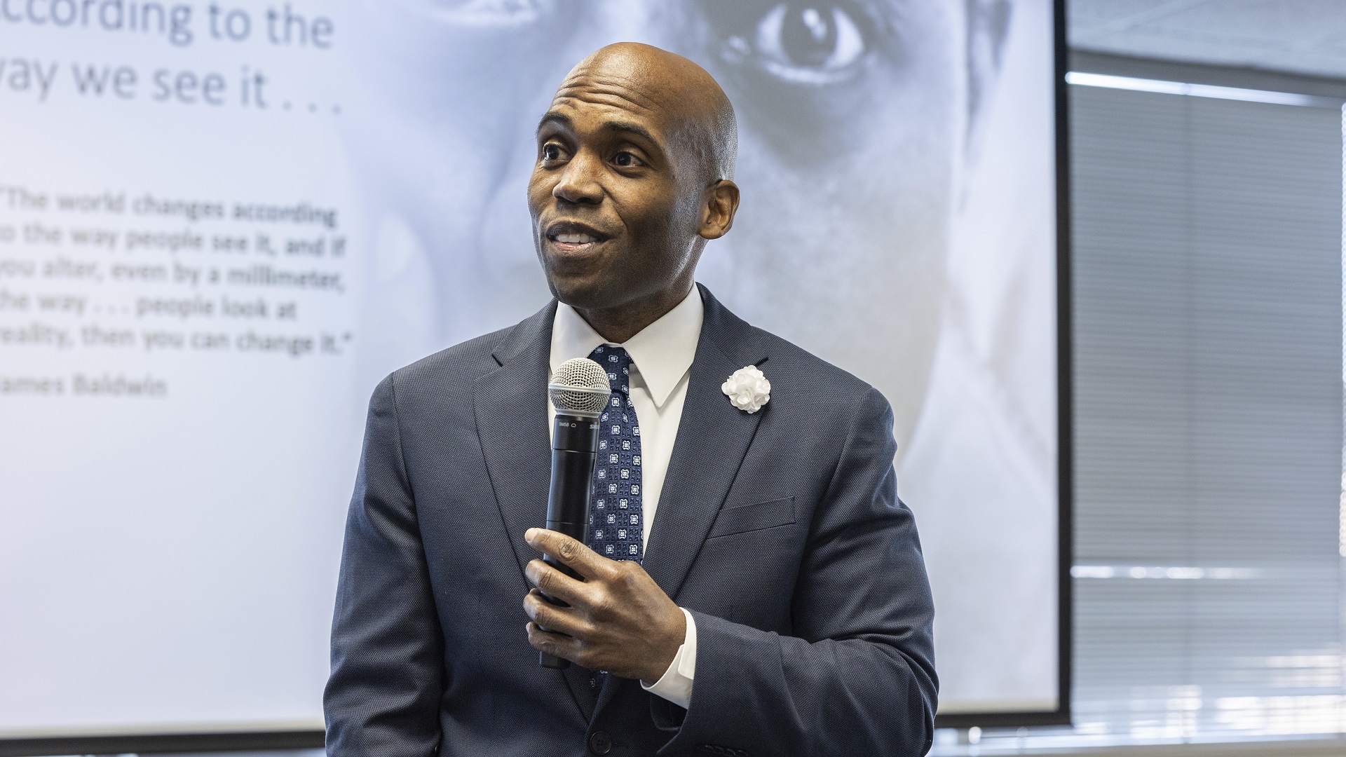 Dr. Yohuru Williams Sitting in an Auditorium