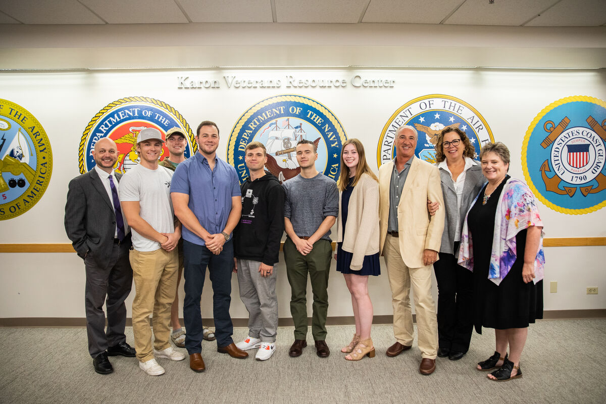 people posed in front of the sign for the Karon Veterans Resource Center
