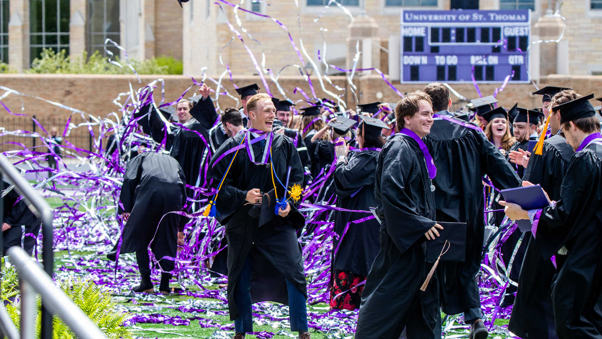 Graduates cheer after the confetti cannons deploy during the 2022 Undergraduate Commencement Ceremony on May 21, 2022, in St. Paul.
