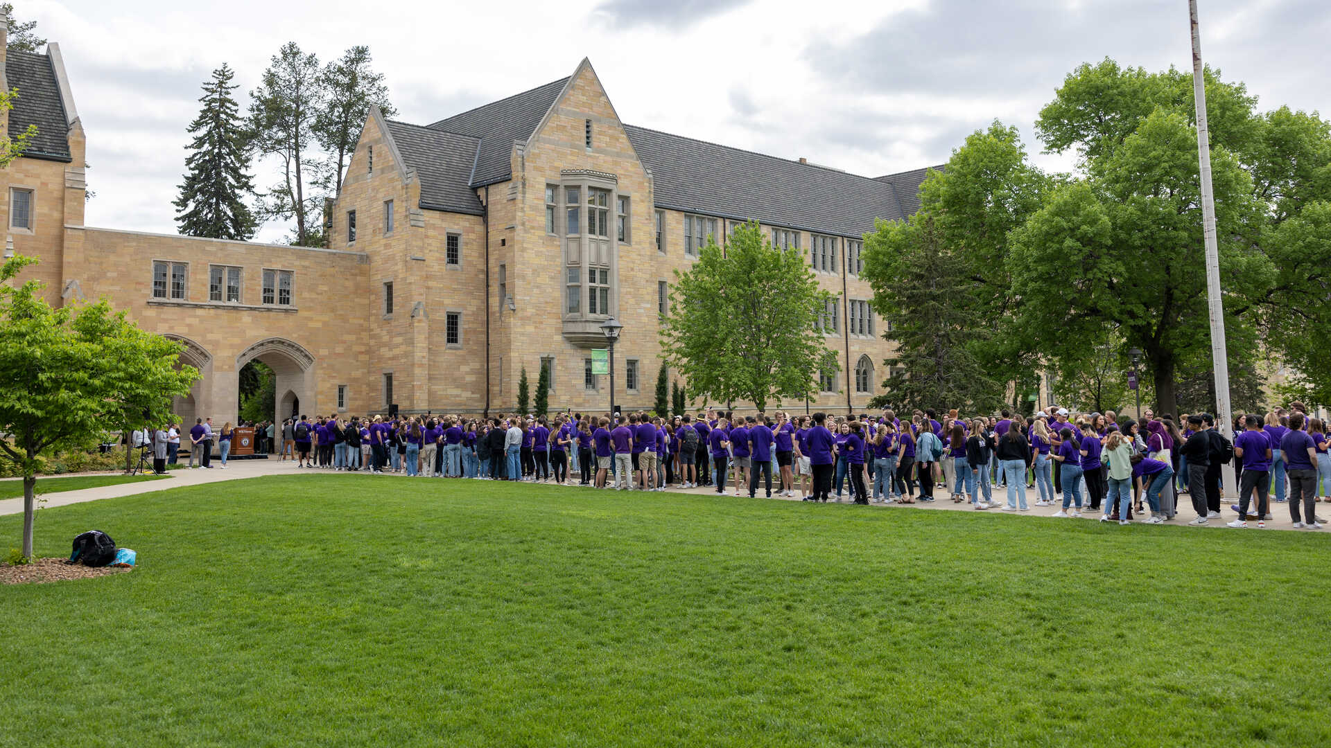 Students lined up outside of the Arches for the tradition of march out of the arches
