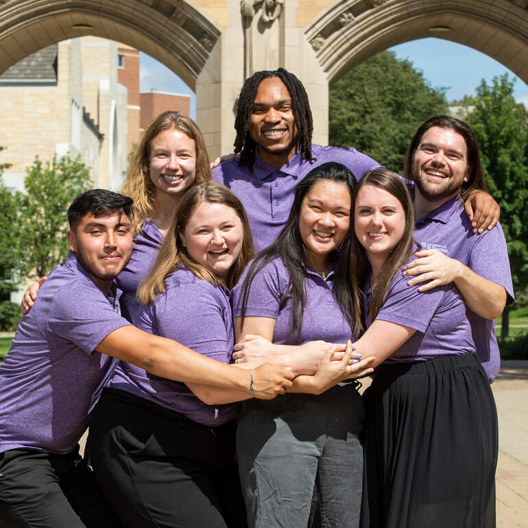 a group of admissions counselors strike a pose