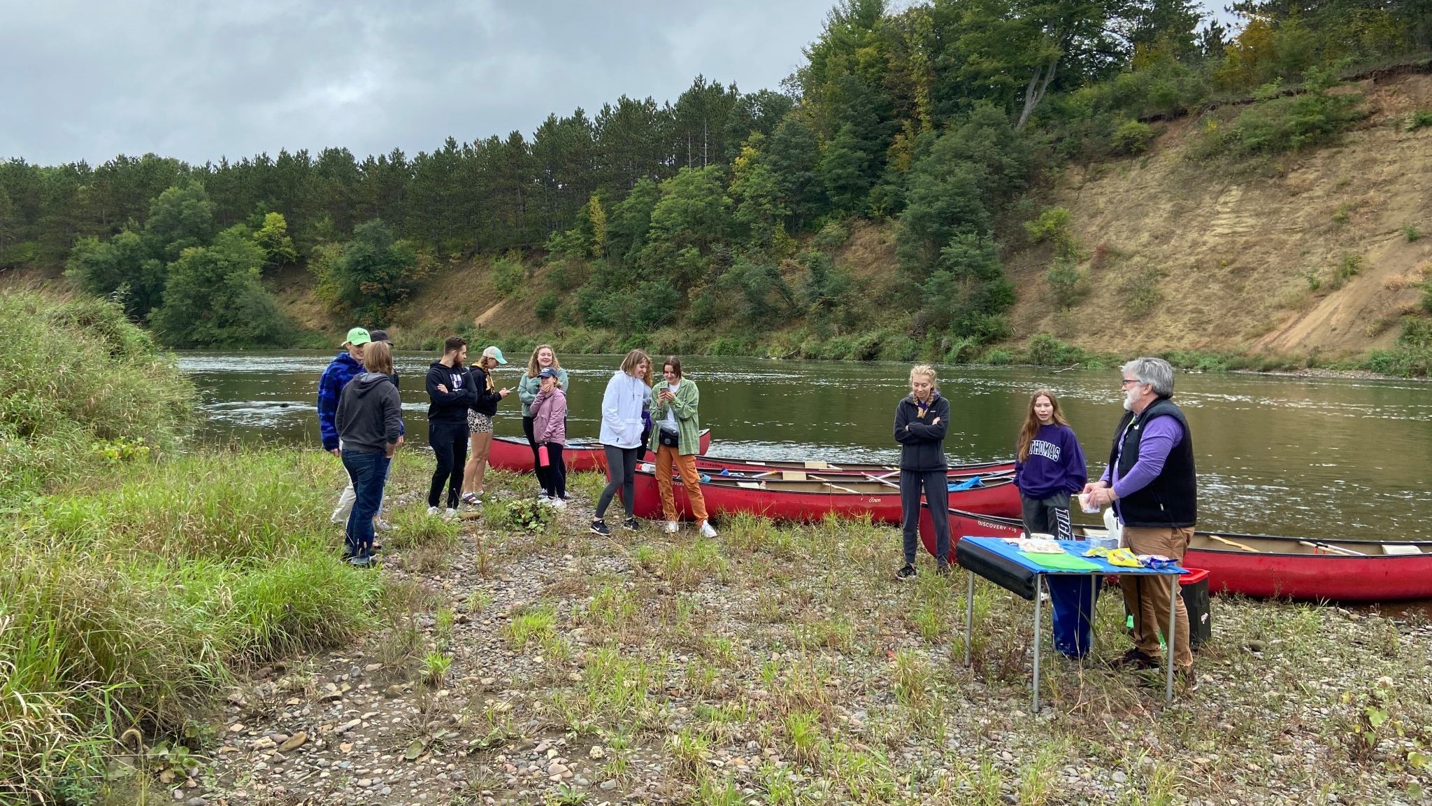 students and professors during an honors seminar canoe trip