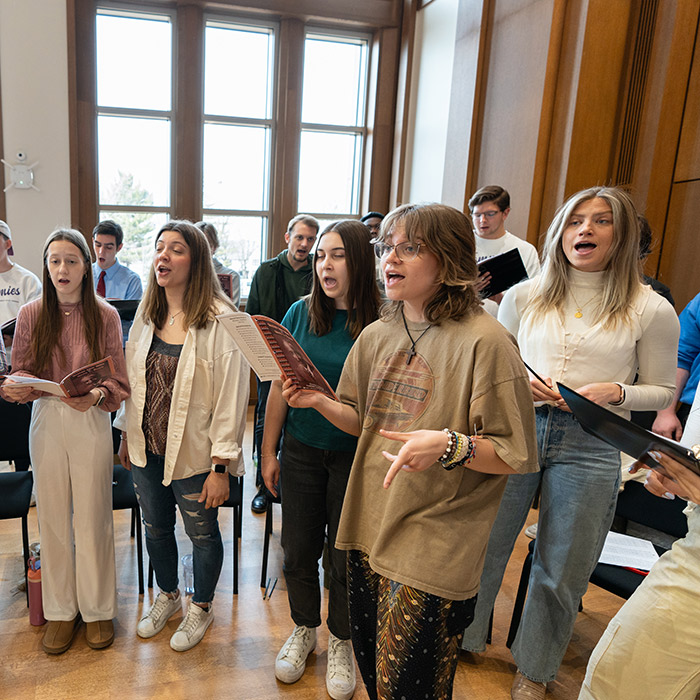 Choral students practice in Schoenecker Center