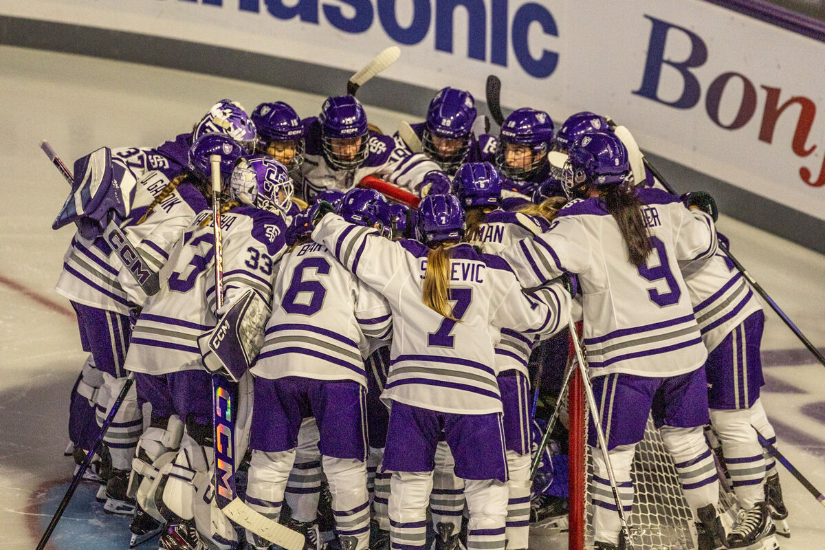 hockey team in a team huddle