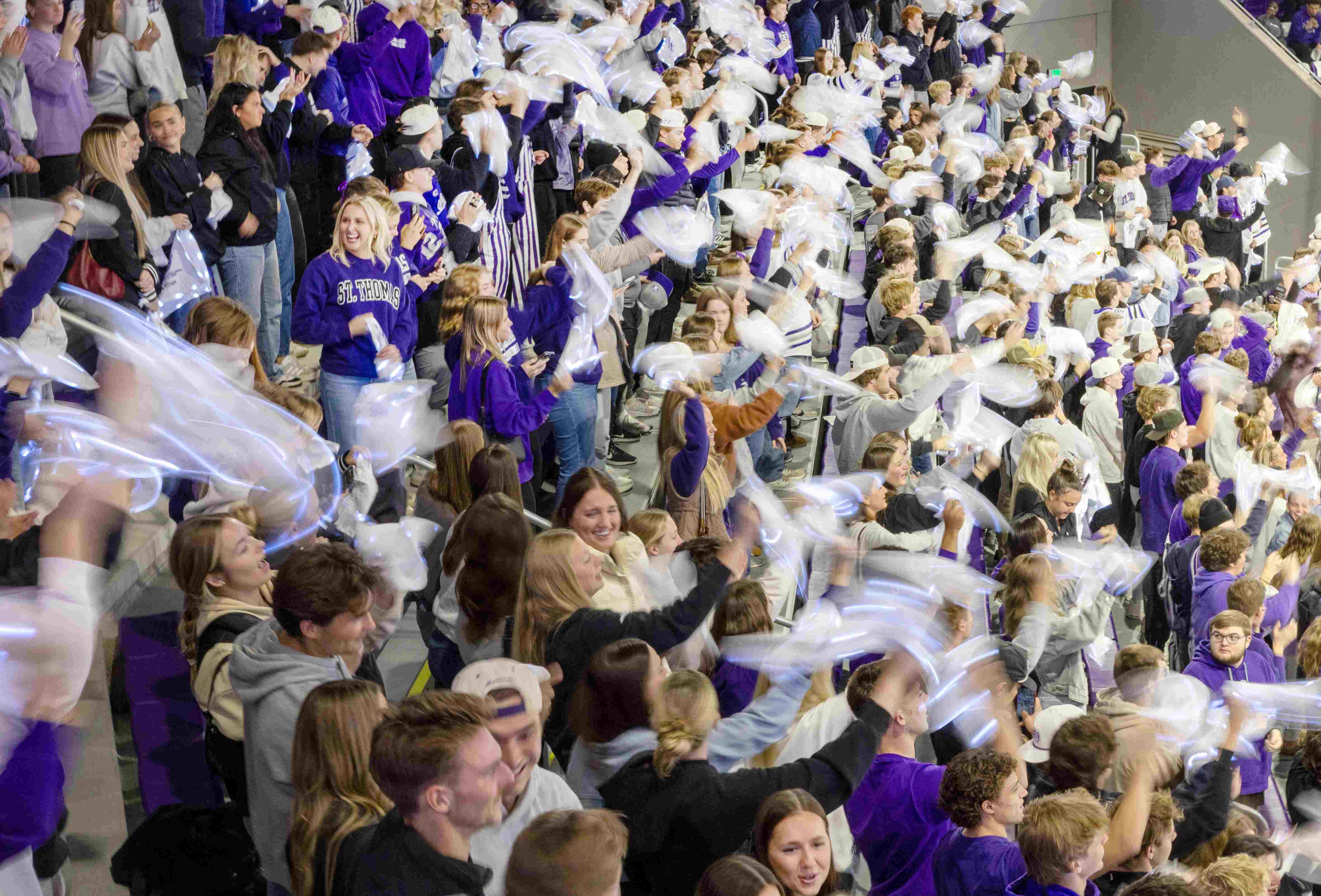 Fans wave light-up towels in the stands of the Lee and Penny Anderson Arena