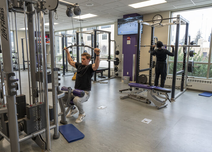 Students working out in the weight room