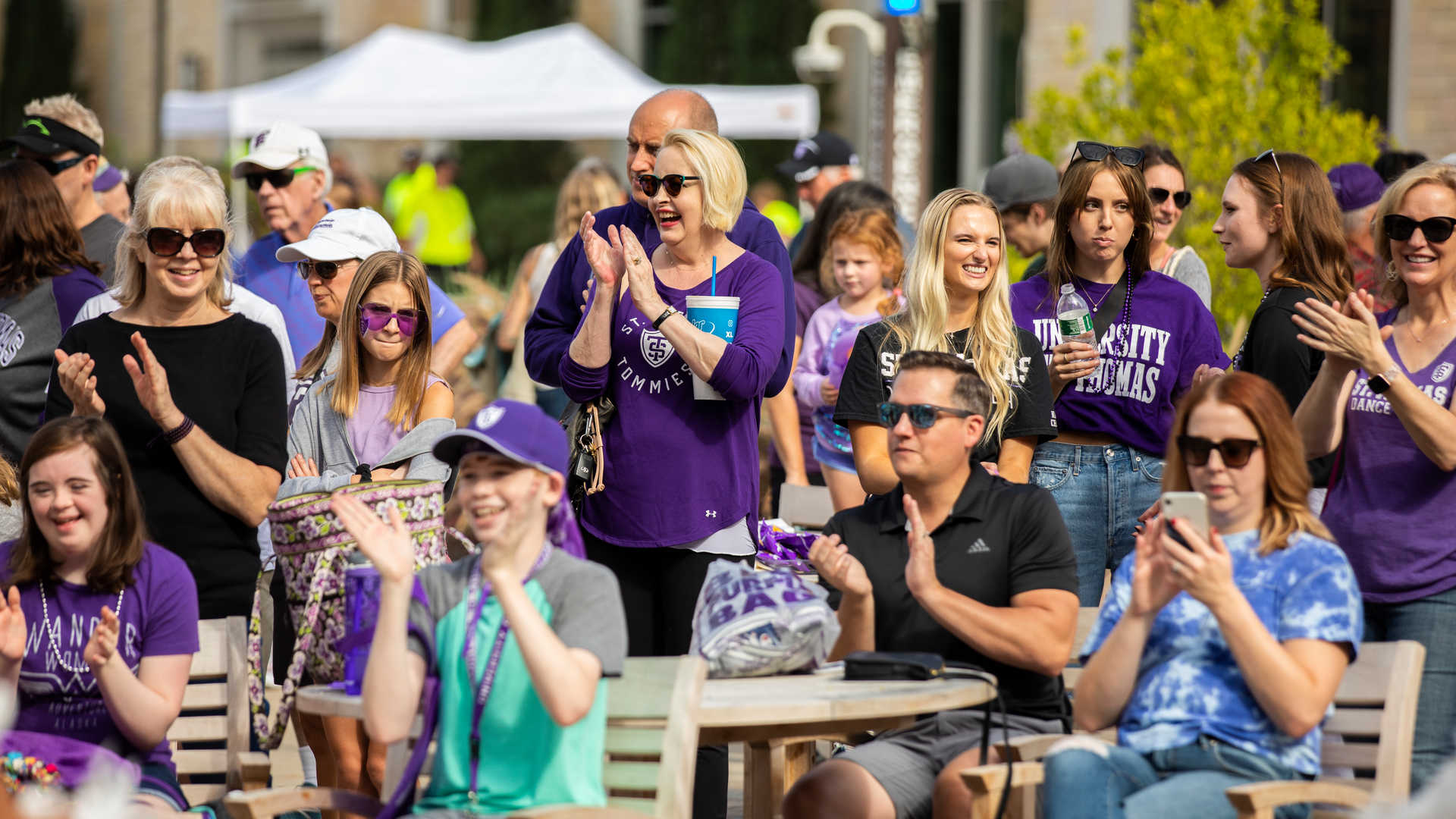 Families cheer during Purple on the Plaza 
