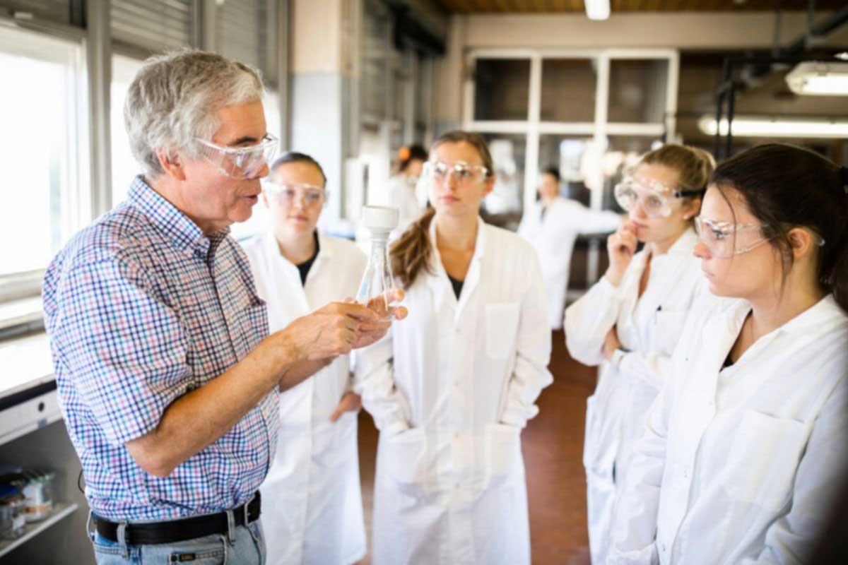 Chemistry professor Bill Ojala instructs students in a lab in Rome, Italy.