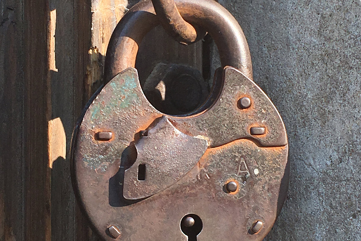 Photo of a rusted padlock at Auschwitz