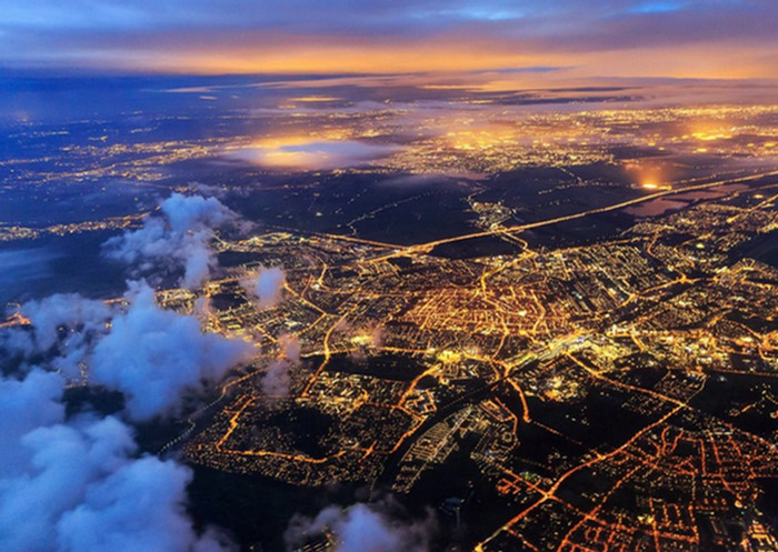bird's eye view of the clouds hovering above civilization