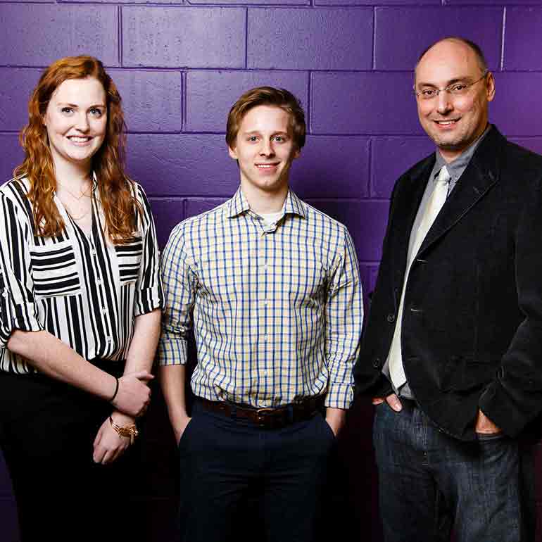 Aaron Redepenning poses with senior design team.