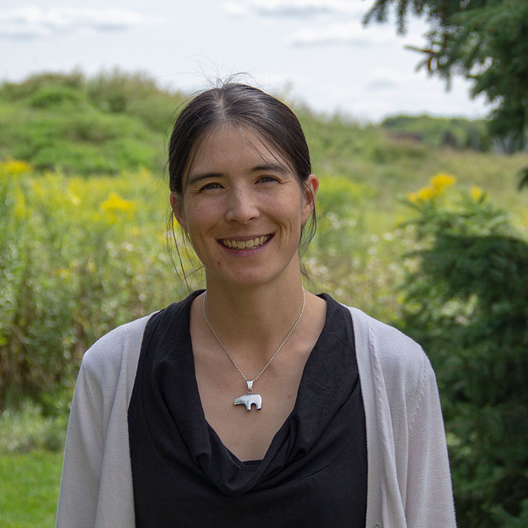Dr. Ali Ling poses in the environment
