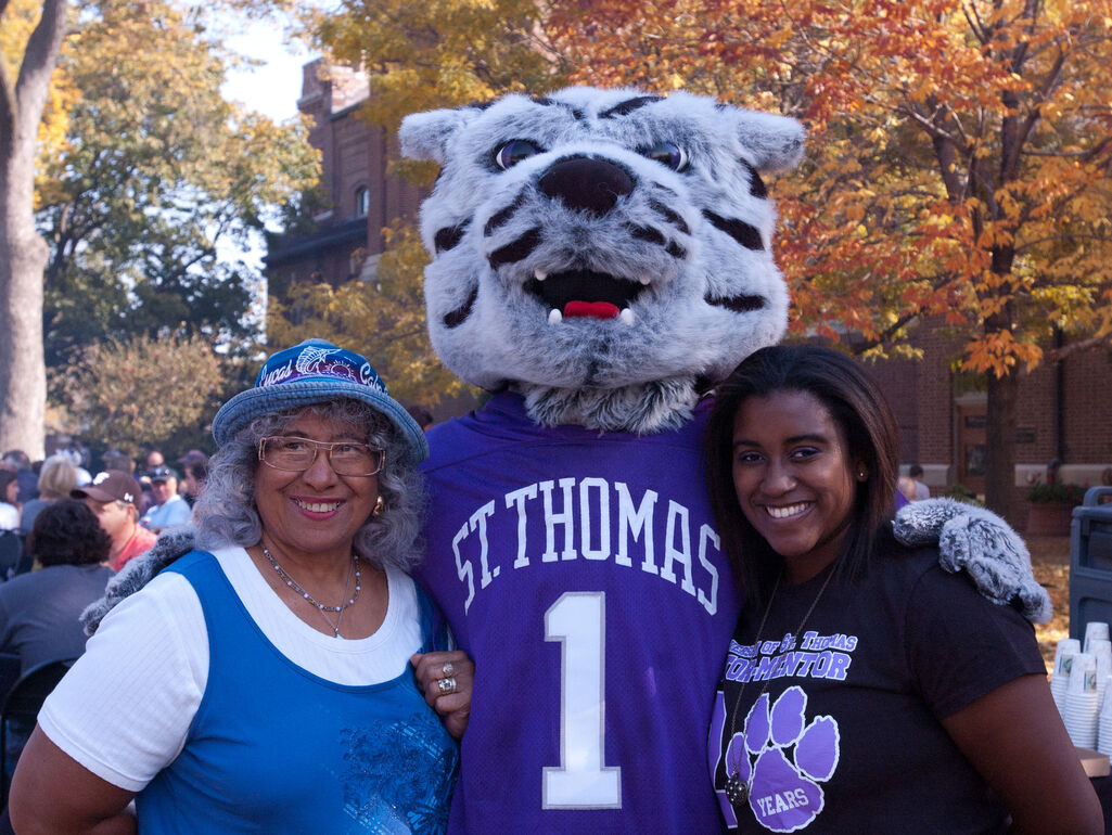 Family poses with mascot