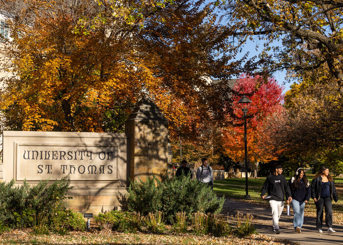 Students walking on campus in fall