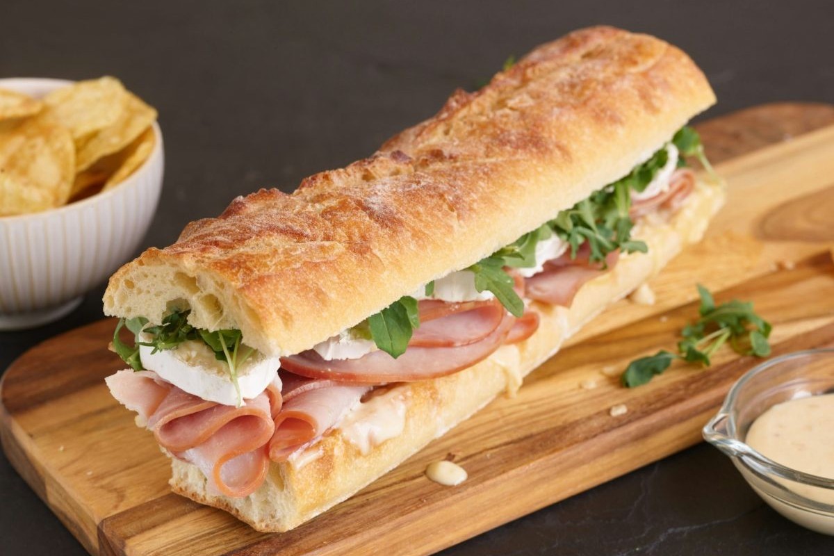 Sub sandwich on a wooden cutting board