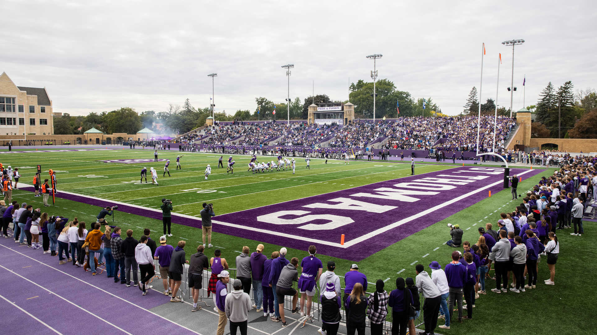Fans surround the field and fill the stands of O’Shaughnessy Stadium