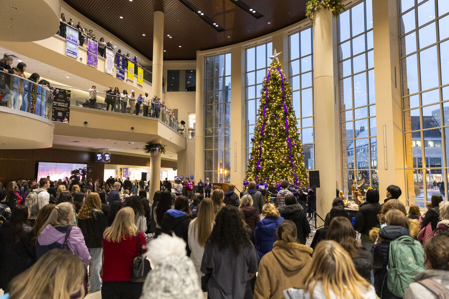 A crowd gathers for the Christmas tree lighting in the Anderson Student Center Ira Kanthak Atrium.
