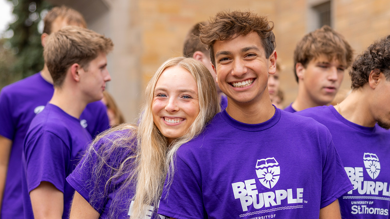 Two students smile for a photo at March through the Arches