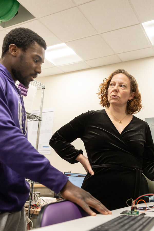 student talks with professor