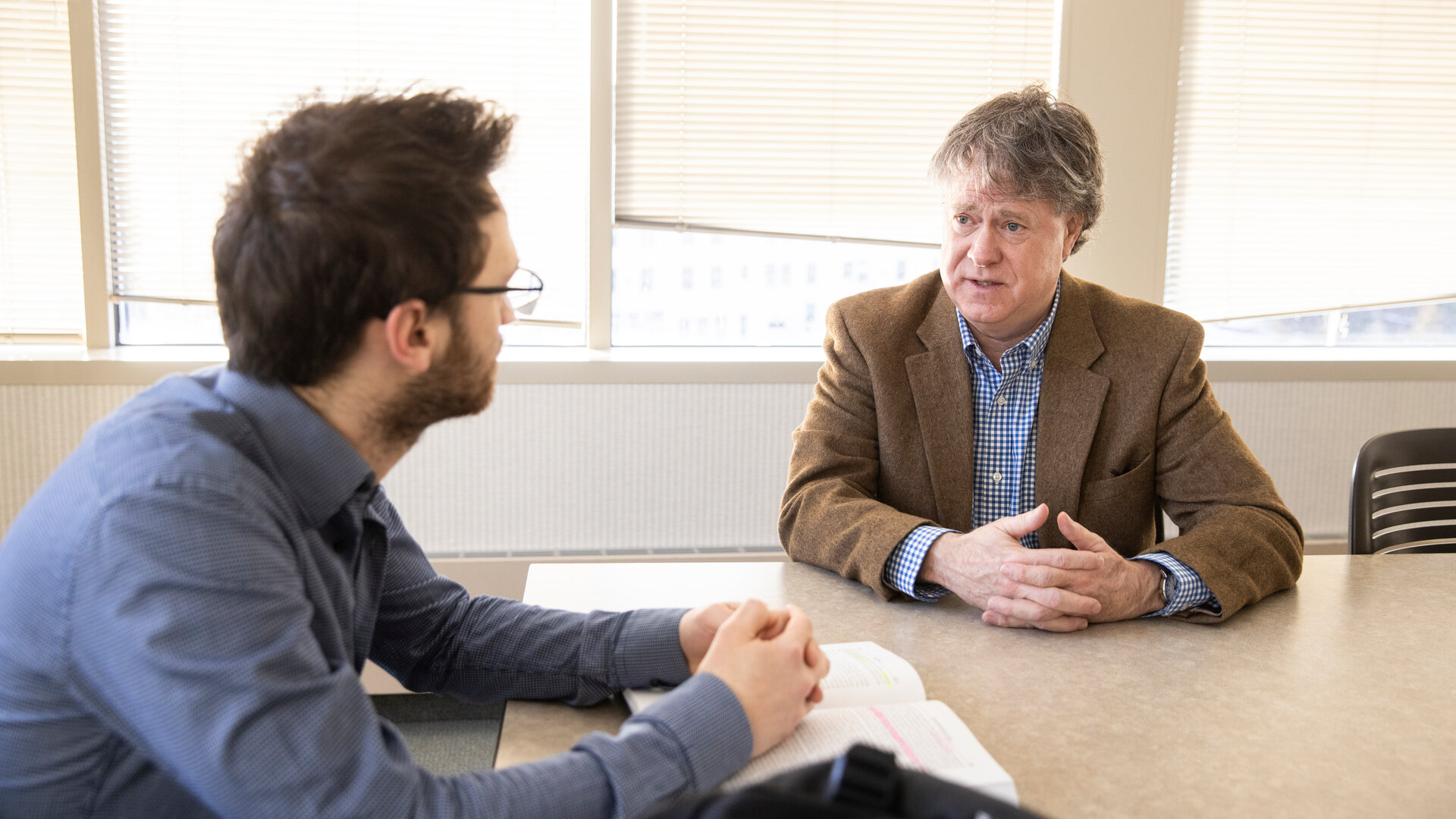 Law professor in discussion with student