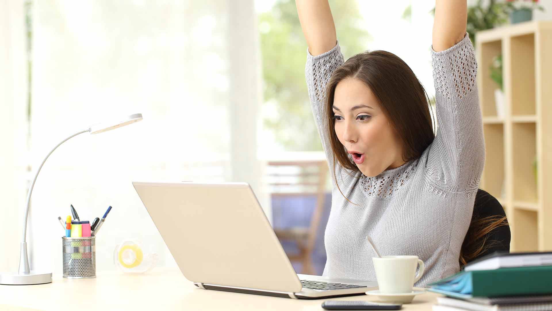 Excited student searching on their computer