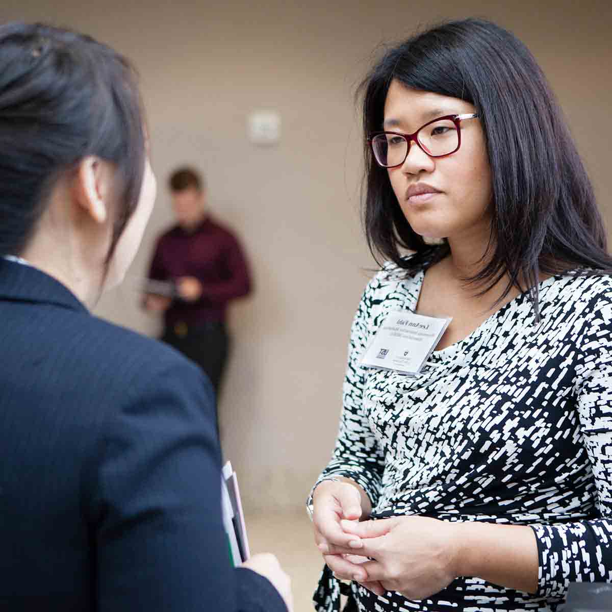 Employers interact with students and alumni at a University of St. Thomas career fair.