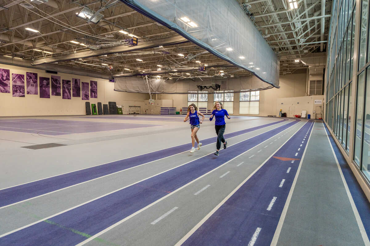 students jog on the indoor track in aarc