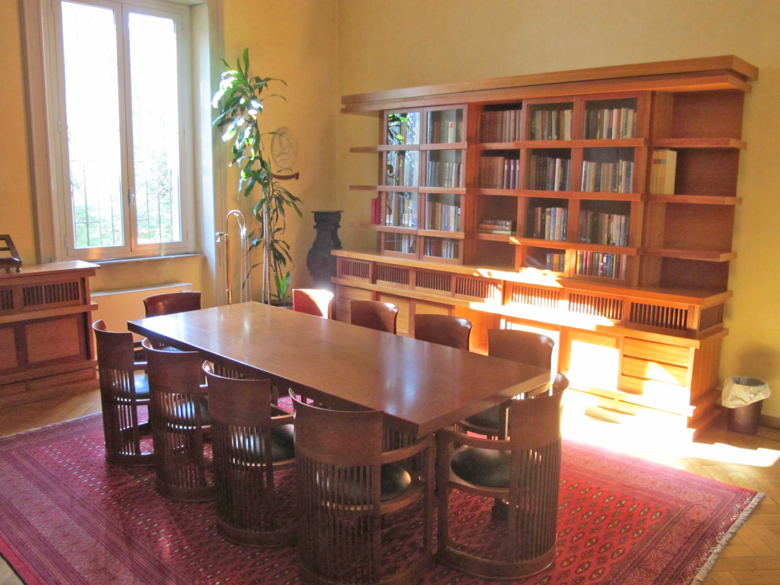 Library with table and bookshelves