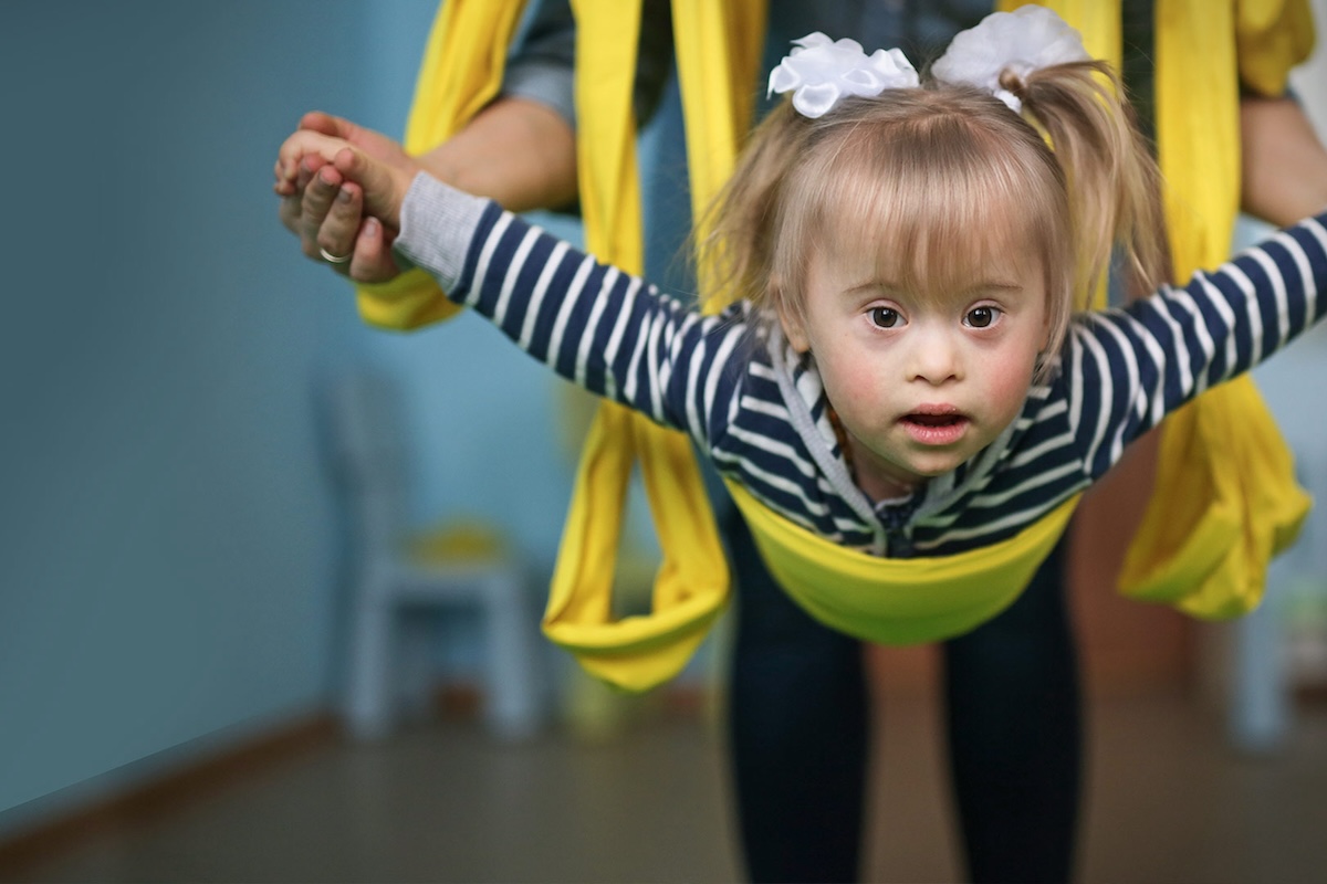 student playing on a harness