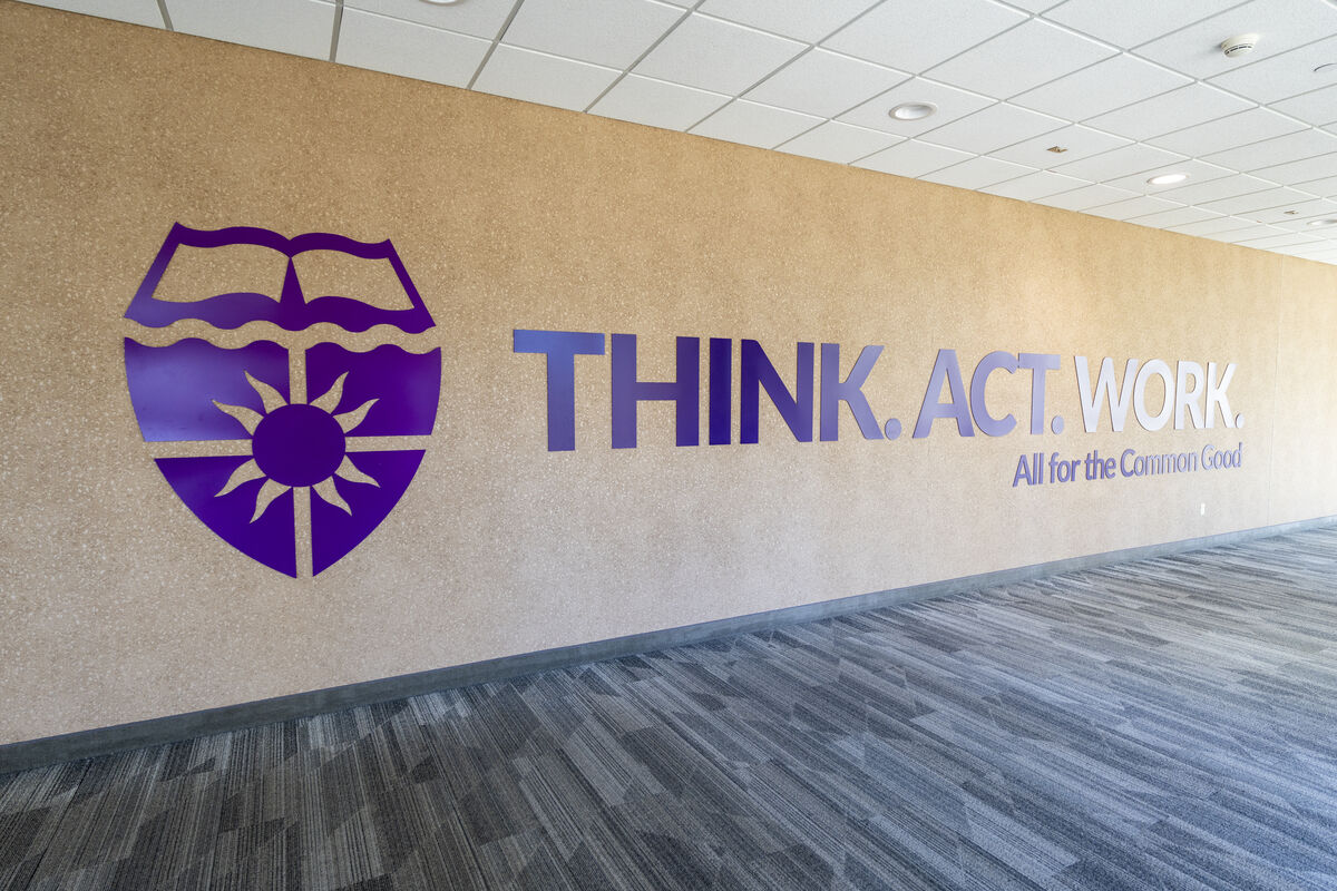 wall graphic saying "think work act"