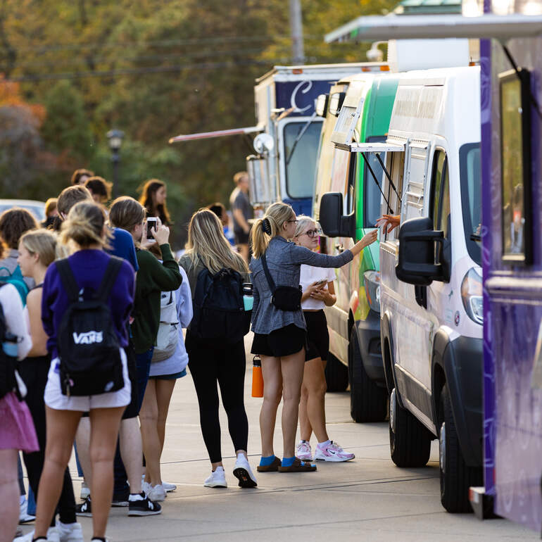 Students lining up at food truck
