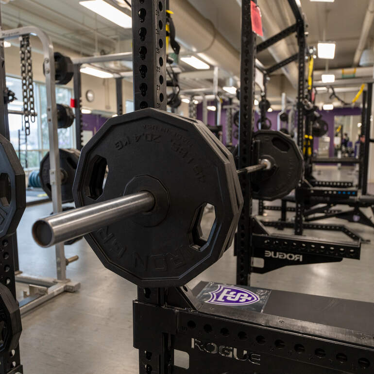 close-up of barbells in the weight room at St Thomas