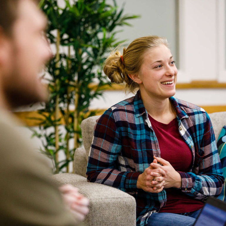 girl sitting in chair smiling