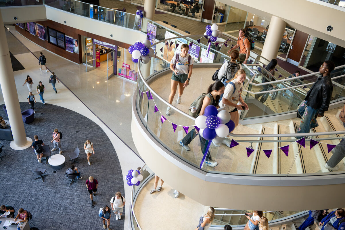 Students walking up the spiral staircase in Anderson Student Center