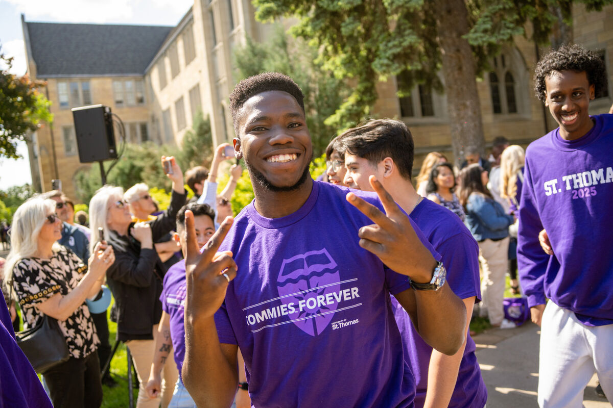 Students posing together and smiling