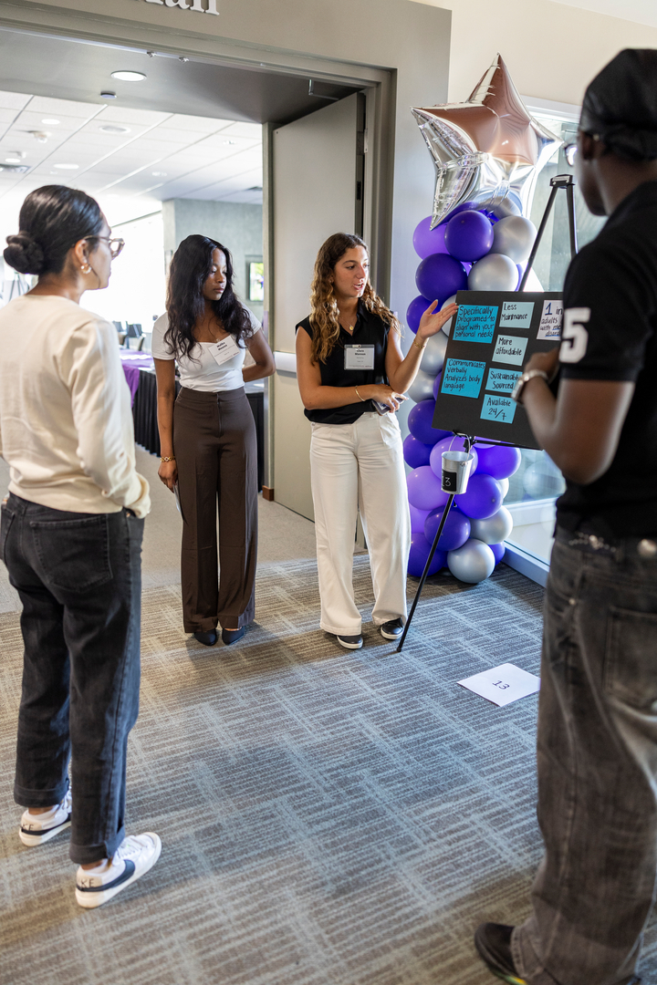 Students practice presenting a business idea and pitch at the Freshman Innovation Day in Woulfe Hall on August 26, 2025 in St. Paul.