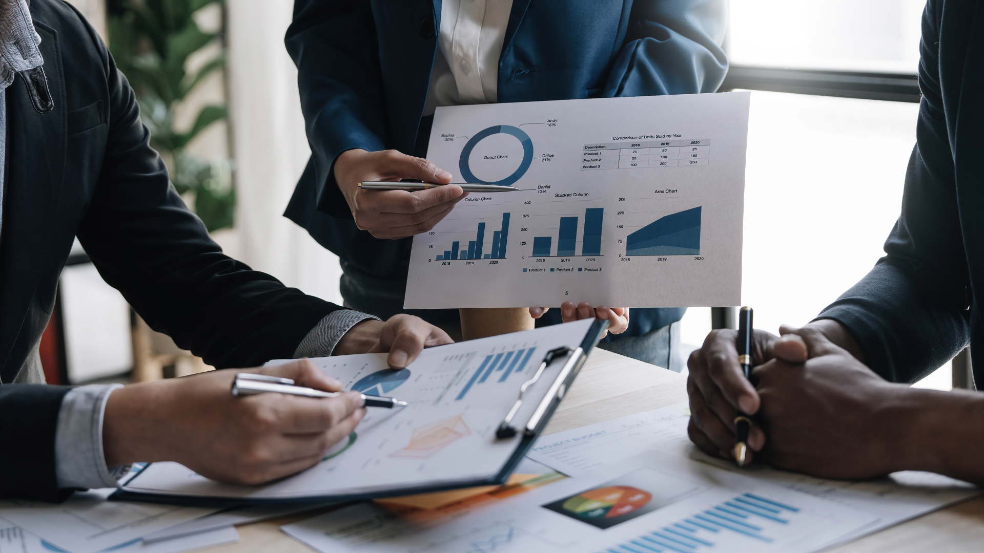 business professionals using charts