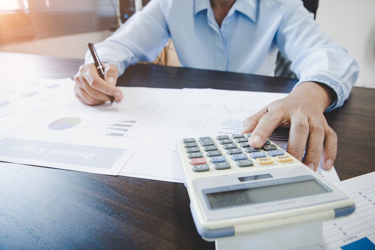 A student works with charts and a calculator.